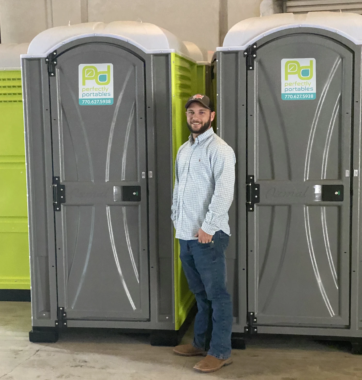 Perfectly Portables team member with portable restroom units